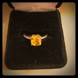 Yellow stone and diamond ring